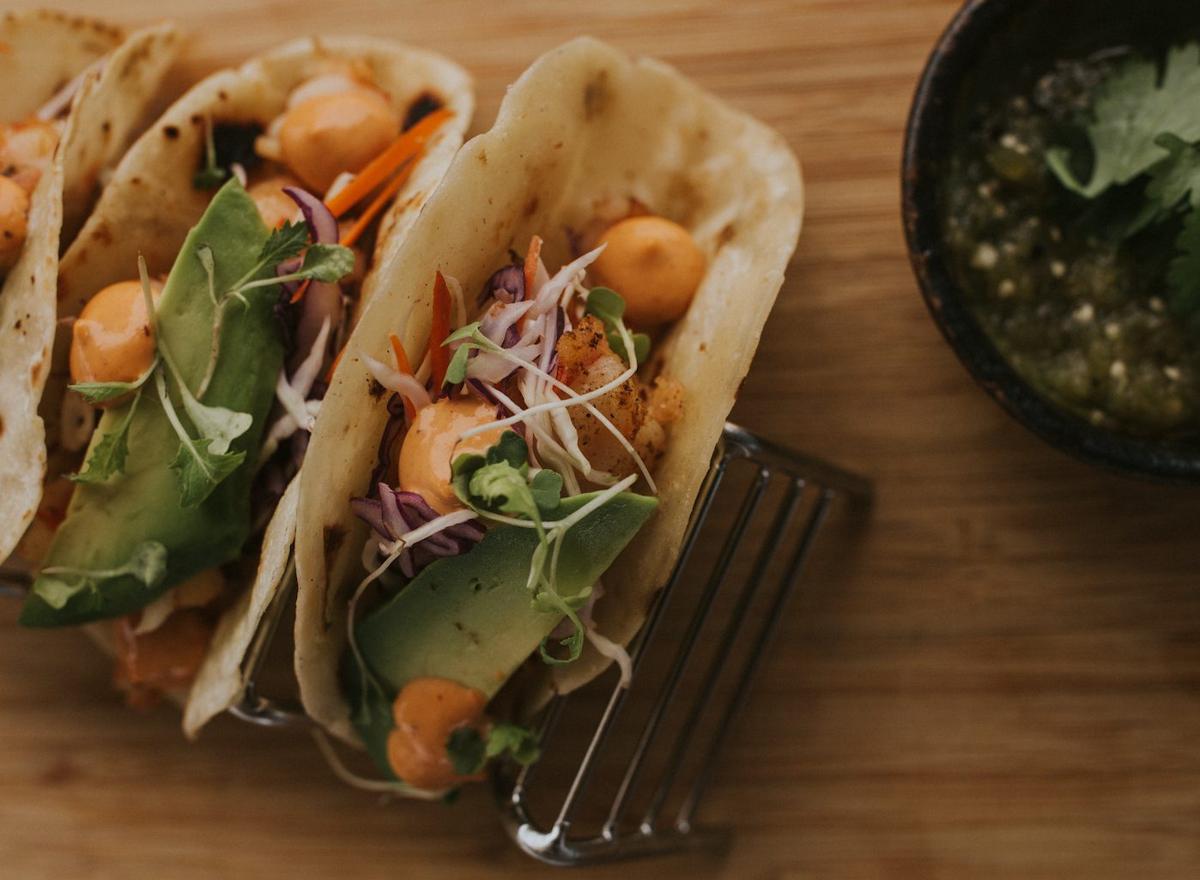 Shrimp tacos with avocado and salsa verde served on the beach at Costa Palmas