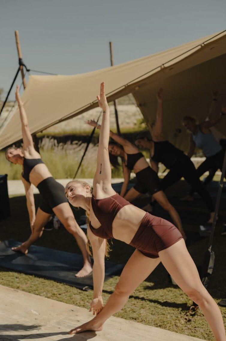 A guided outdoor fitness session under the shade sail at Jimmy&rsquo;s
